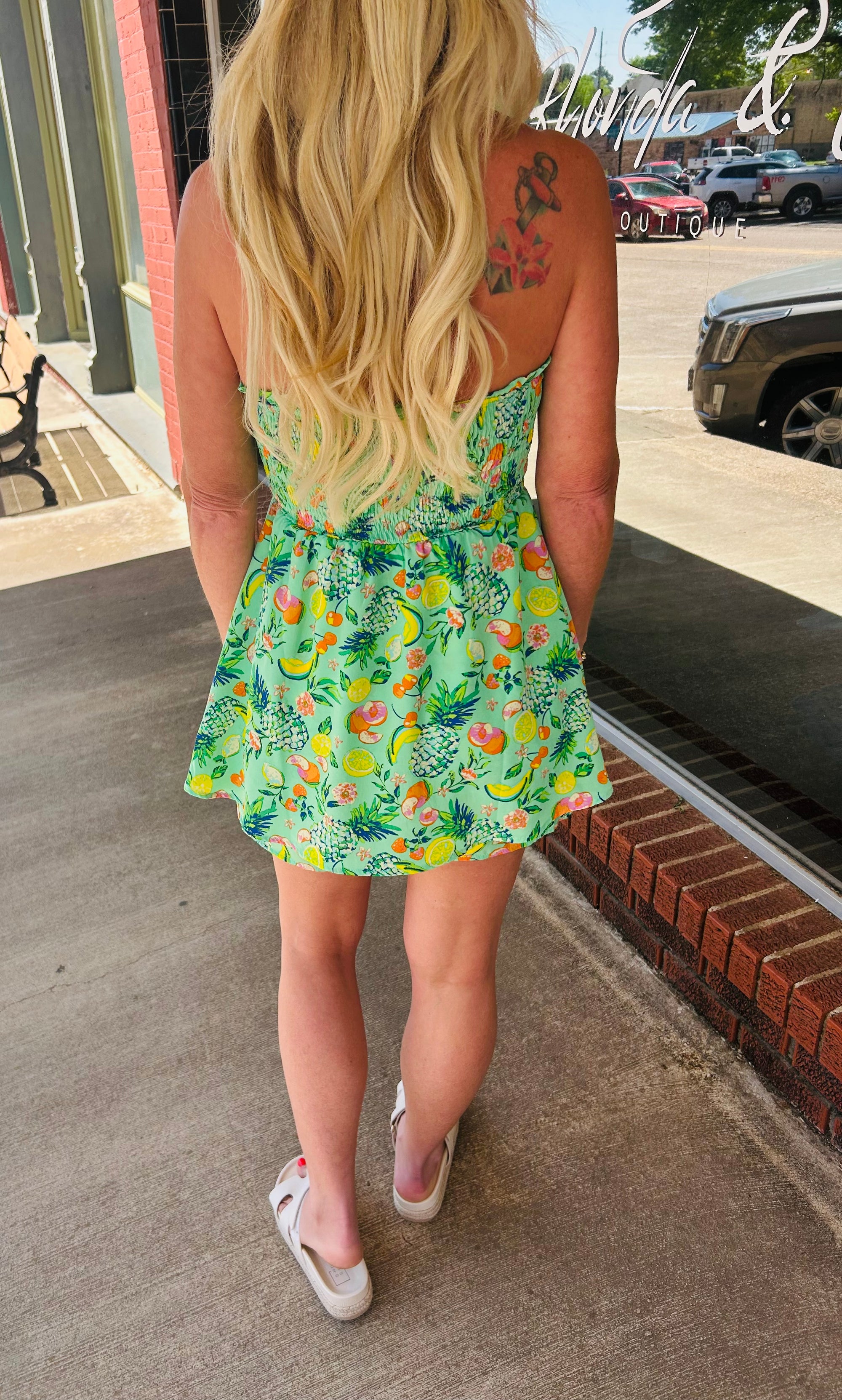 Green multi strapless romper
