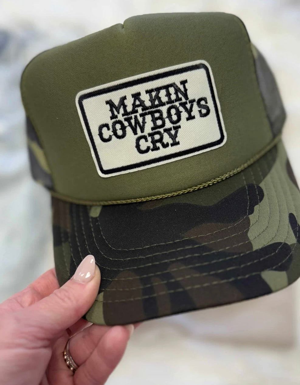 Makin cowboys cry trucker hat